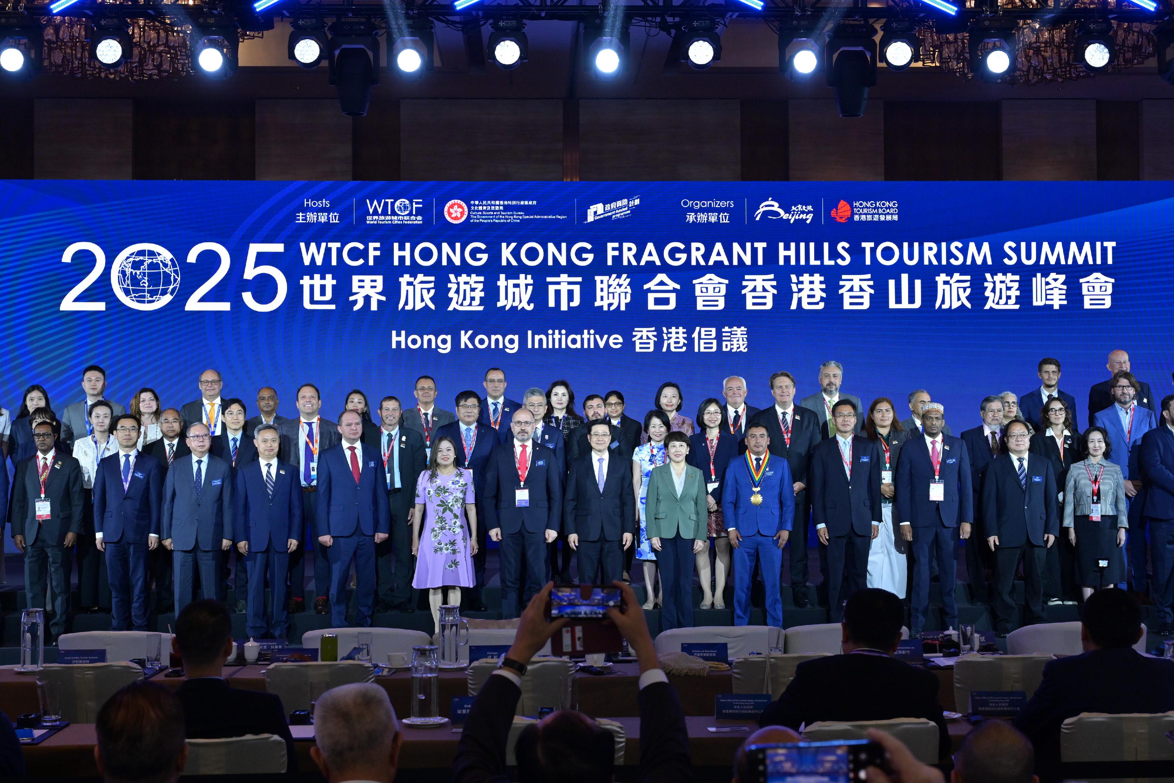 The Chief Executive, Mr John Lee, attended the 2025 World Tourism Cities Federation (WTCF) Hong Kong Fragrant Hills Tourism Summit today (April 15). Photo shows Mr Lee (first row, seventh right); the Governor of Asti Province and Mayor of Asti City, Italy, Mr Maurizio Rasero (first row, seventh left); Vice Mayor of Beijing Municipality and Executive Vice-Chair of the WTCF Council, Ms Sima Hong (first row, sixth right); Deputy Director of the Liaison Office of the Central People's Government in the Hong Kong Special Administrative Region (HKSAR) Mr Qi Bin (first row, fourth right); Deputy Commissioner of the Office of the Commissioner of the Ministry of Foreign Affairs of the People's Republic of China in the HKSAR Mr Pan Yundong (first row, second right); and the Secretary for Culture, Sports and Tourism, Miss Rosanna Law (first row, sixth left), with other guests.